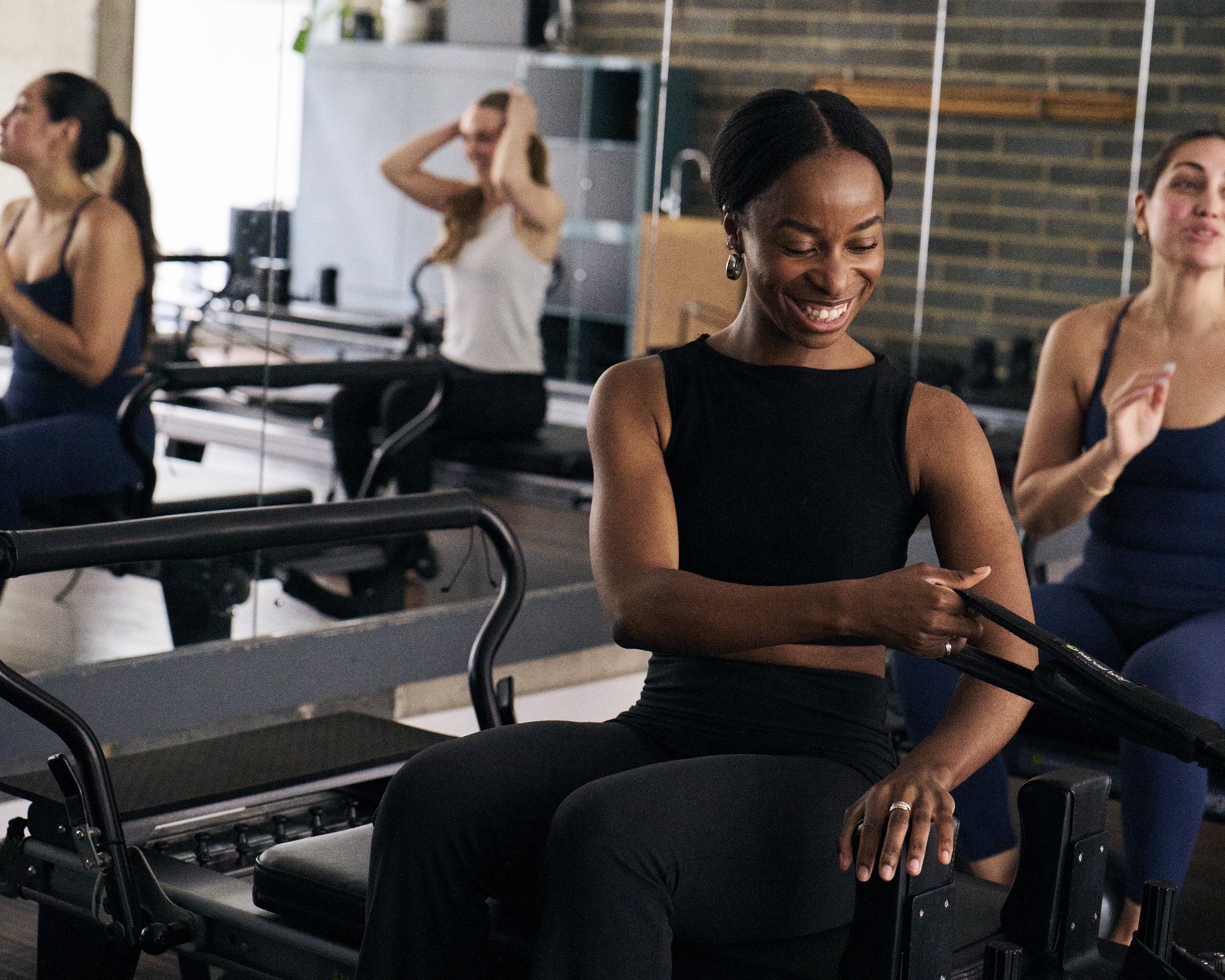 Tempo Pilates trainers on reformers Tempo Pilates trainers on reformers